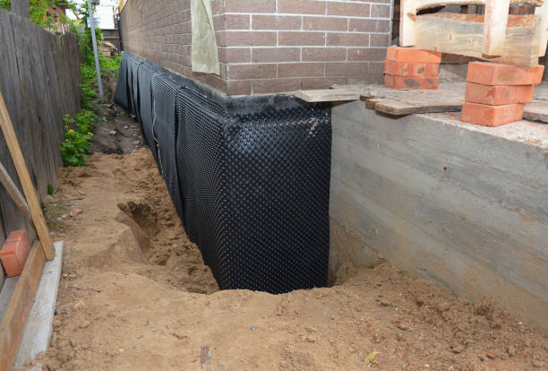 Happy homeowners after waterproofing job in Dumont